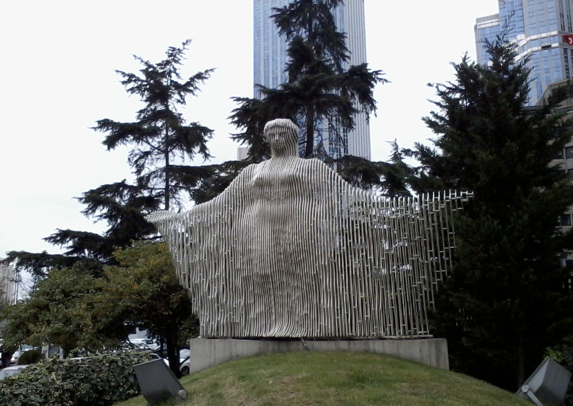 Figure of a woman, standing with open arms metal sculpture (Akdeniz).