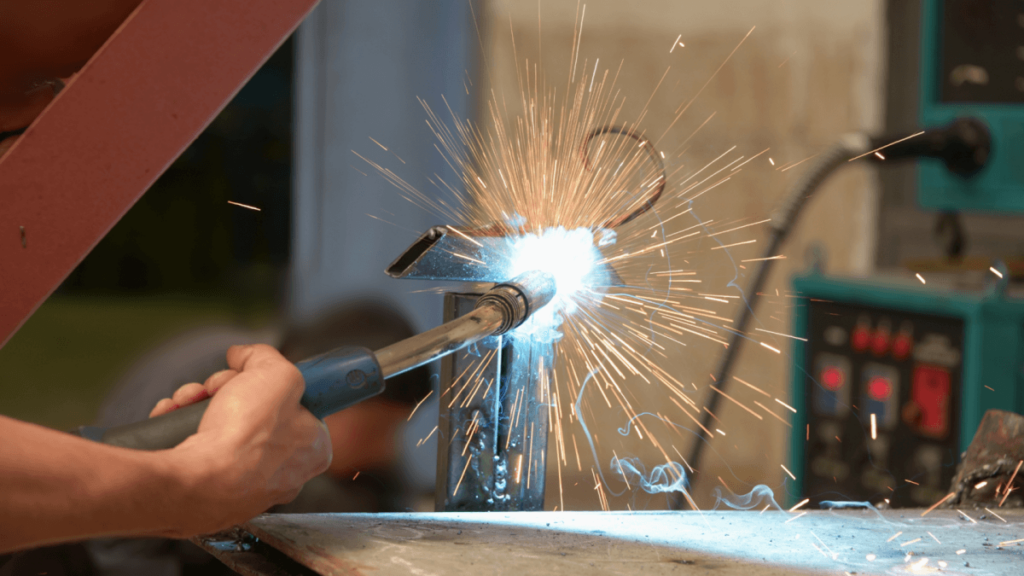 Gas welding machine on workers hand