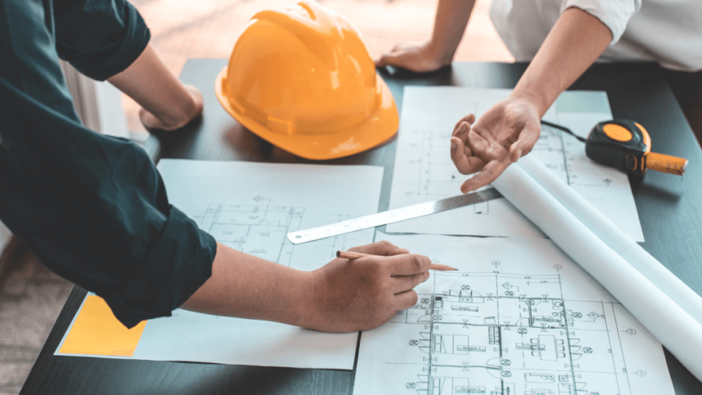 structural engineers with paperwork and drawings