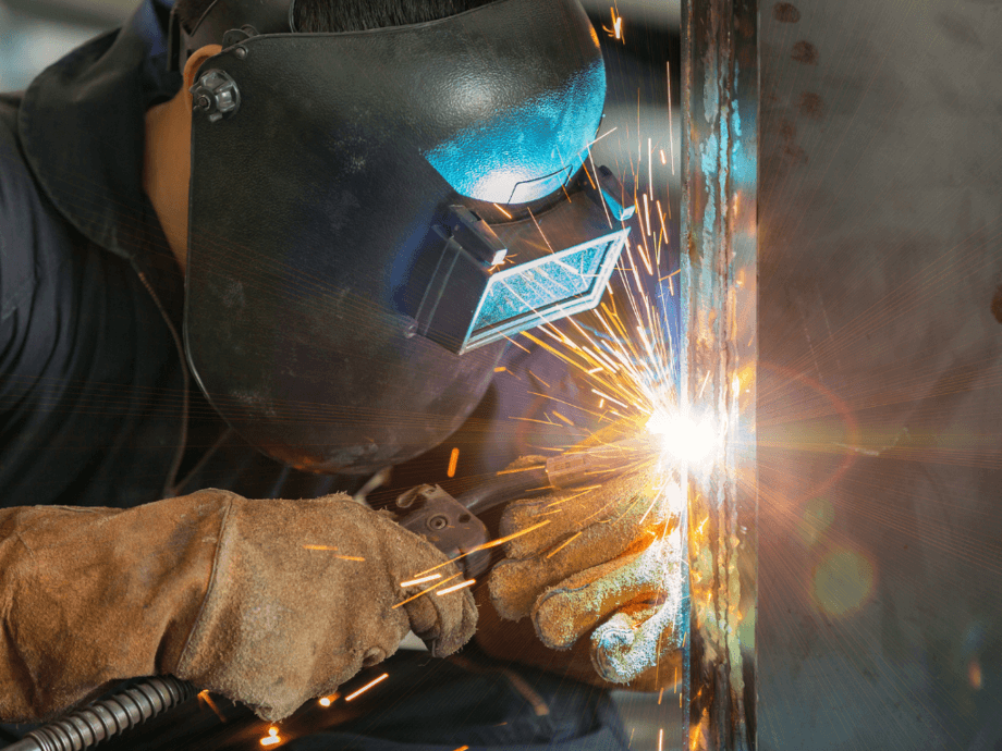 A worker is constructing by using MIG welding