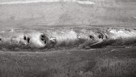 welding defect that results from unwanted gasses being trapped within the molten weld