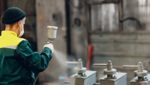 An operator adjusts a nest of parts, delivered to the machine via OSH Cut’s custom software